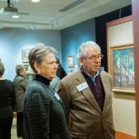 Guests admiring paintings at Friends of Alten 2018